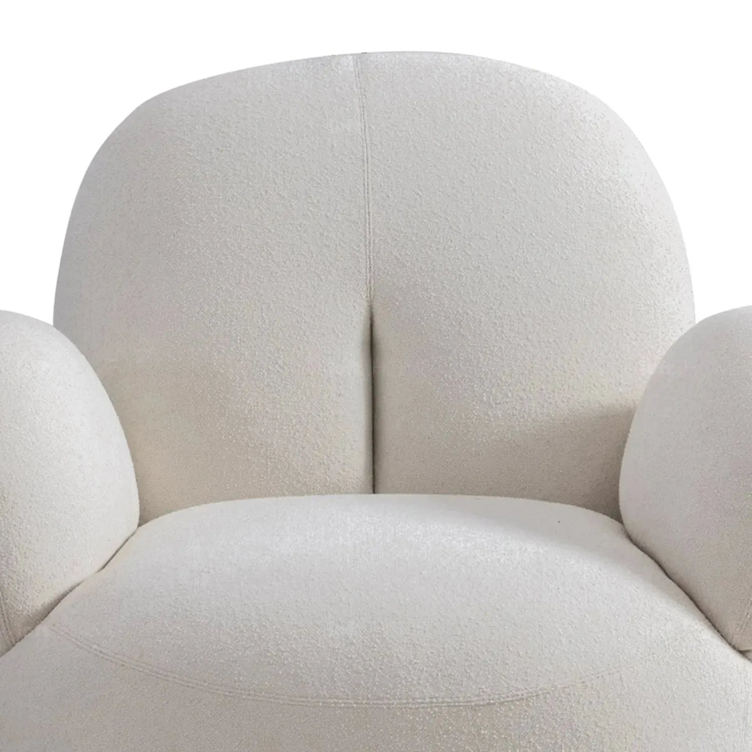 Cream boucle fabric revolving 1 seater sofa boucle in details.