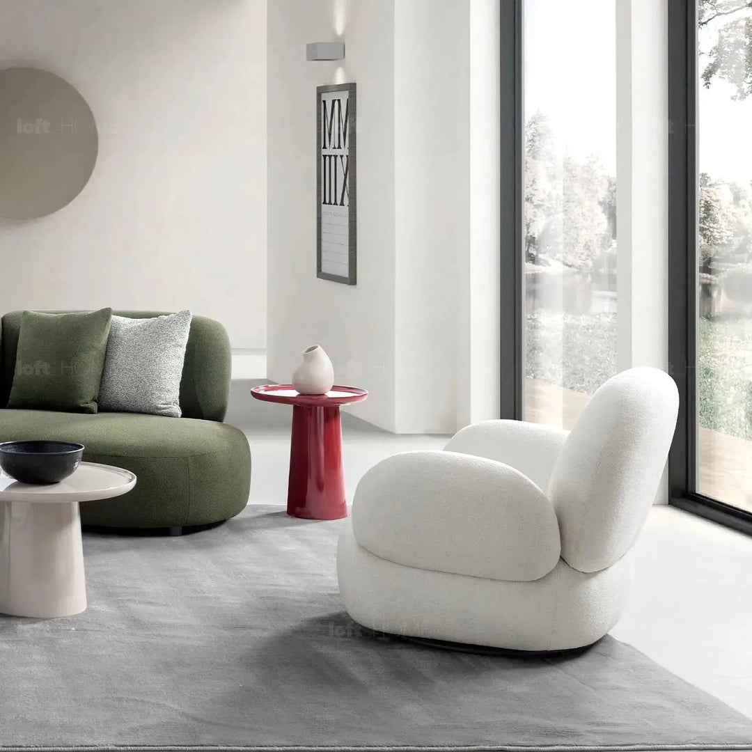 Cream boucle fabric revolving 1 seater sofa boucle in close up details.