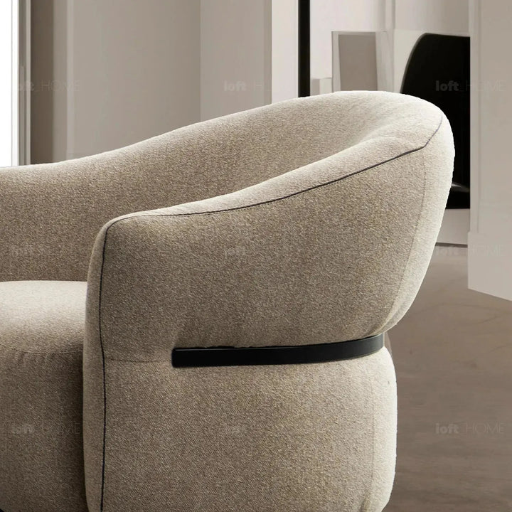 Modern mixed weave fabric revolving 1 seater sofa slate in close up details.