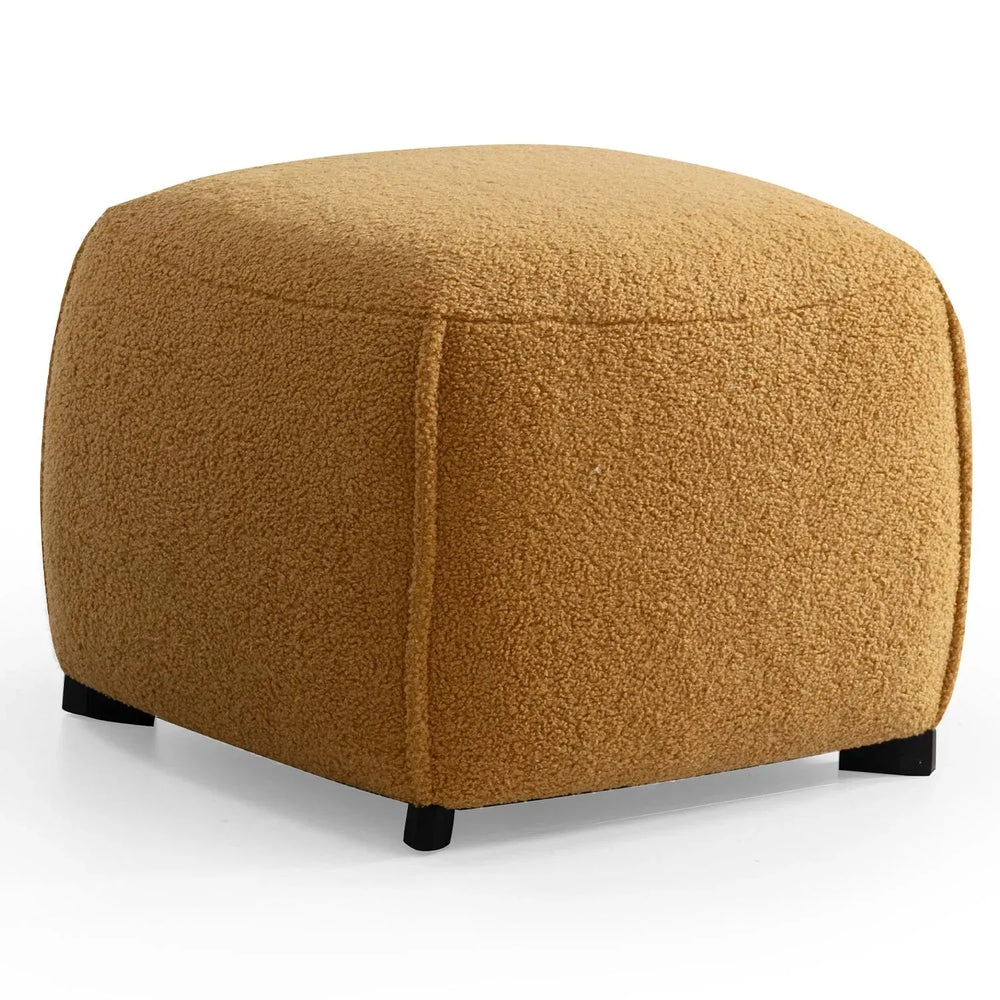 Cream sherpa fabric ottoman saffron in white background.