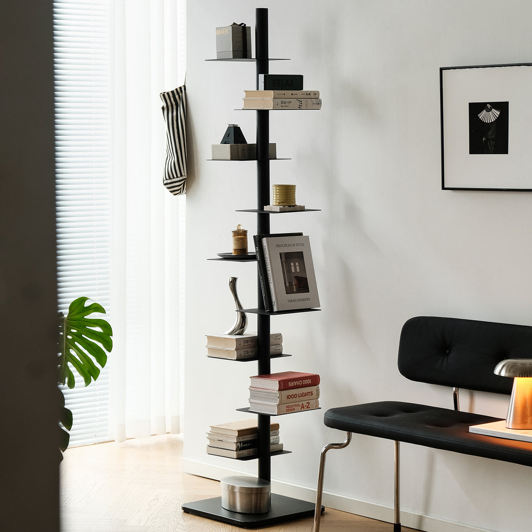 Minimalist steel revolving bookshelf stack primary product view.
