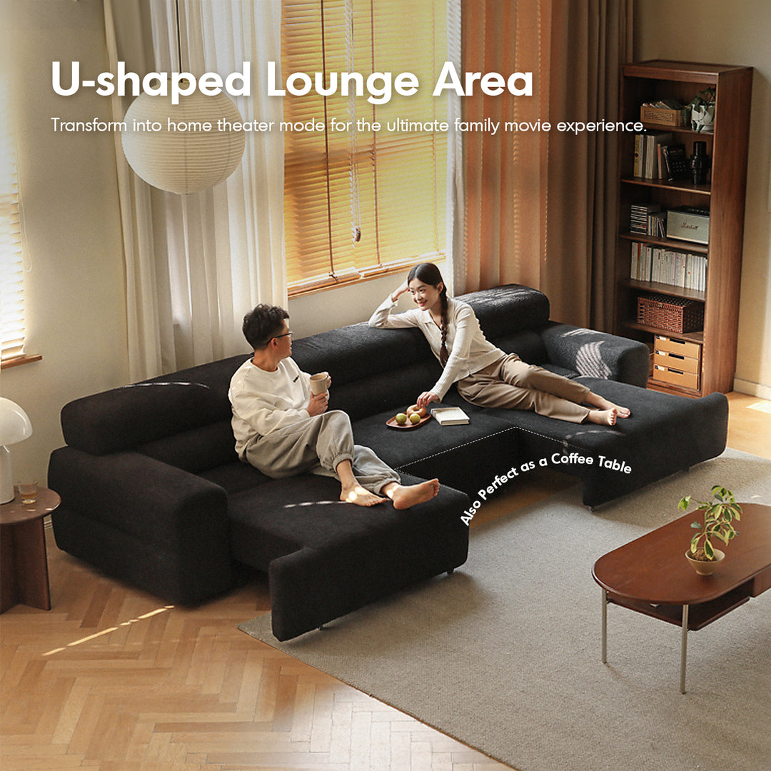 Cream boucle fabric electric functional 4 seater sofa bed sleepo in panoramic view.