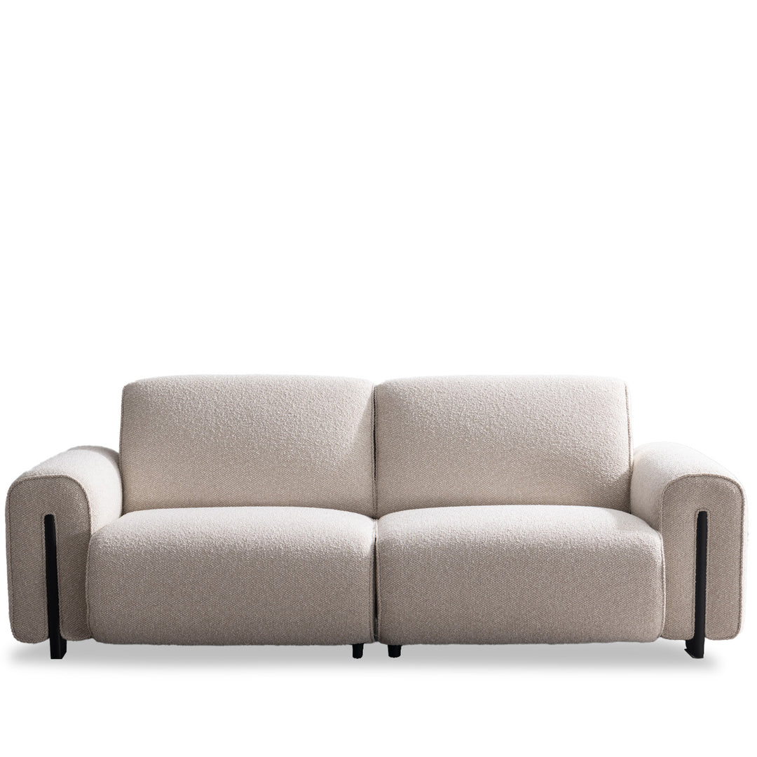 Minimalist boucle fabric modular 3 seater sofa colle in white background.