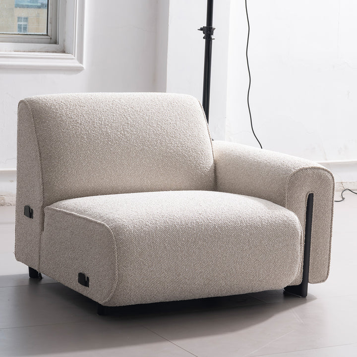 Minimalist boucle fabric modular 3 seater sofa colle in close up details.