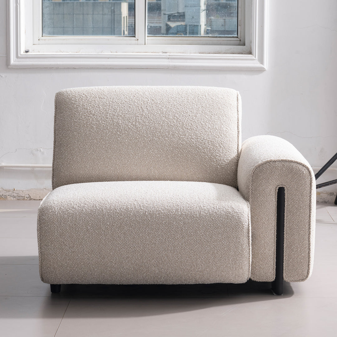 Minimalist boucle fabric modular 4 seater sofa colle in close up details.