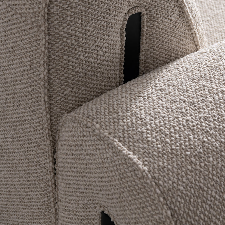 Minimalist boucle fabric modular corner 1 seater sofa colle in close up details.