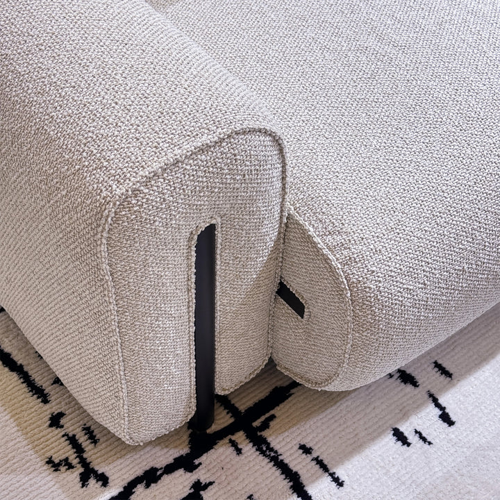 Minimalist boucle fabric modular corner 1 seater sofa colle in panoramic view.