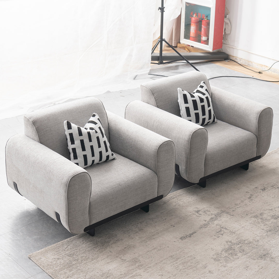 Modern mixed weave fabric 1 seater sofa griddy with context.