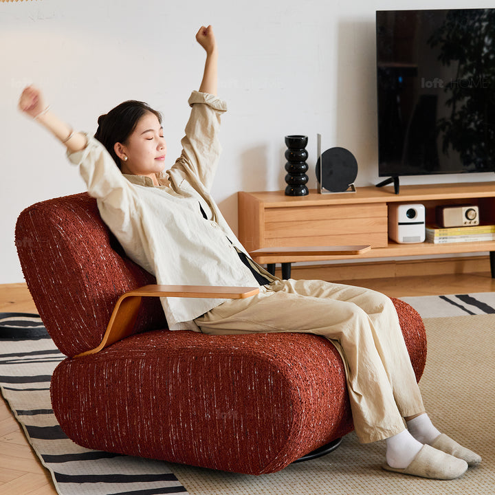 Modern mixed weave fabric revolving 1 seater sofa benny in panoramic view.