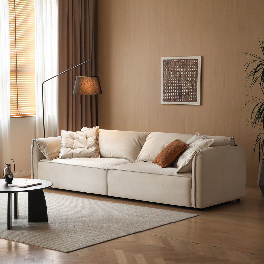 Modern suede fabric sectional 4 seater sofa looma in still life.