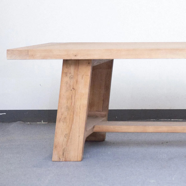 Rustic elm wood dining table forge in close up details.