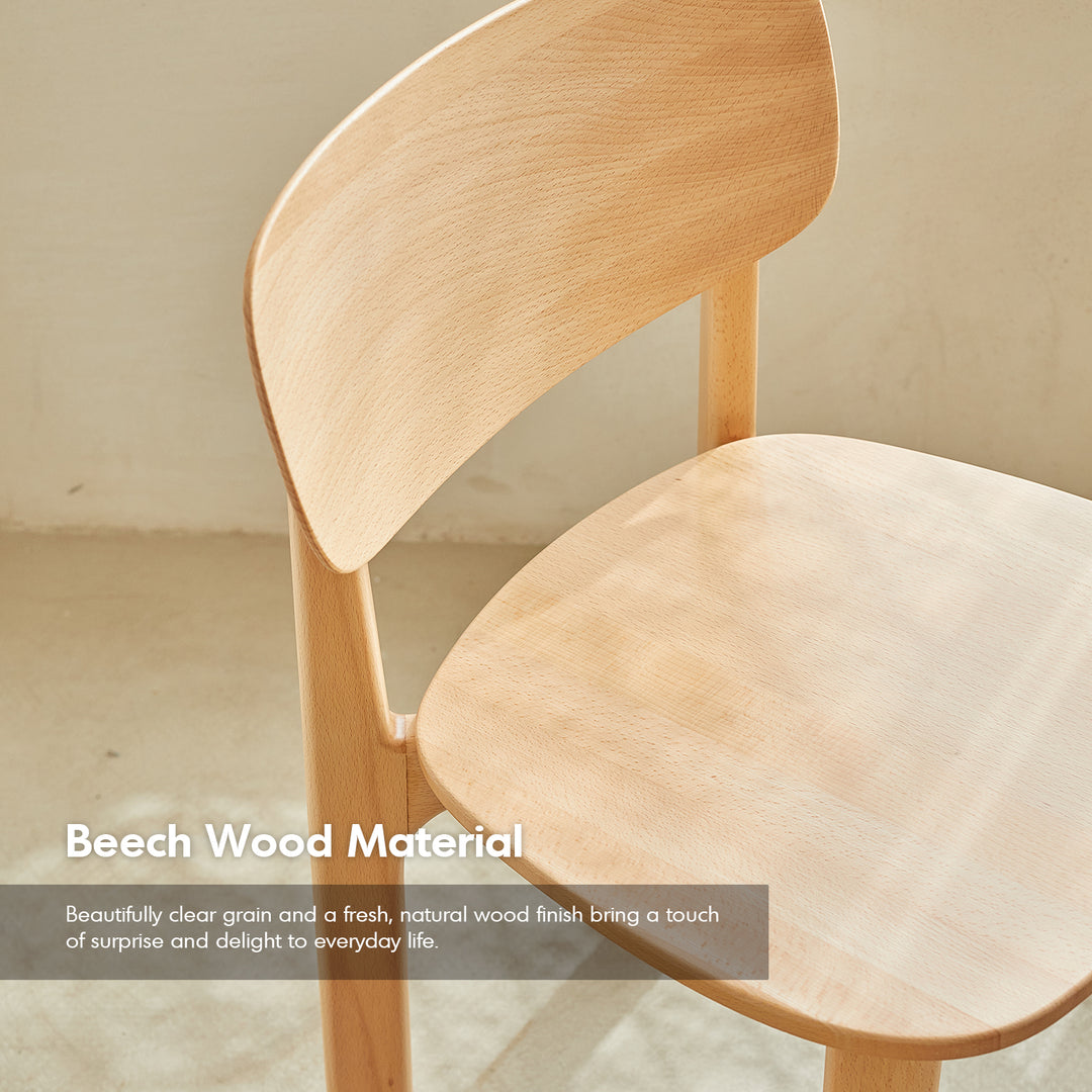 Scandinavian beech wood dining chair poppy with context.