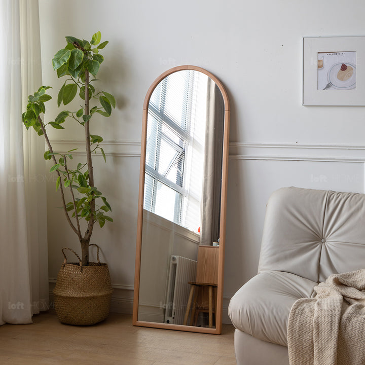Scandinavian beech wood wall hanging dressing mirror glimmer in close up details.