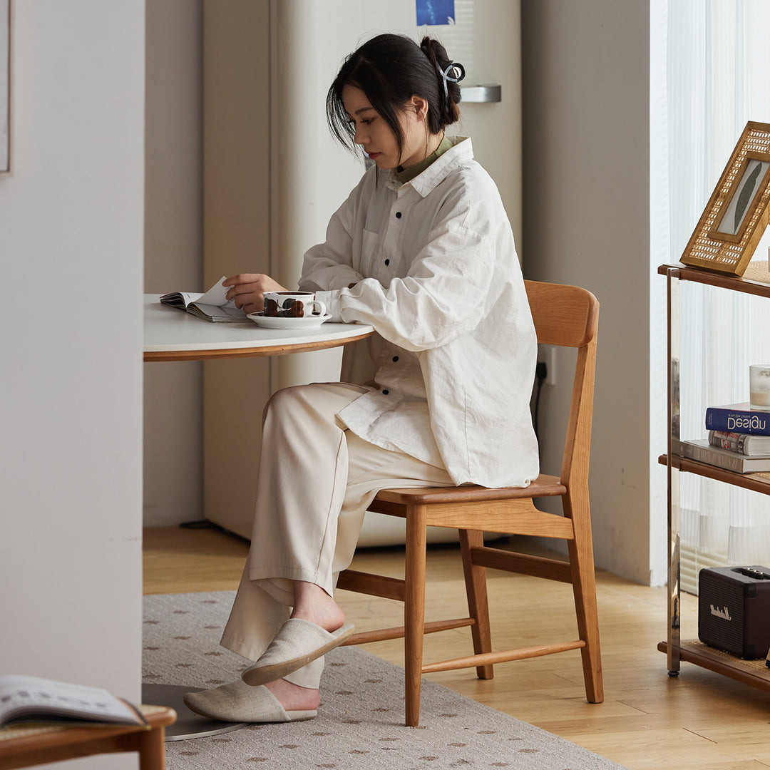 Scandinavian cherry wood dining chair modo in close up details.