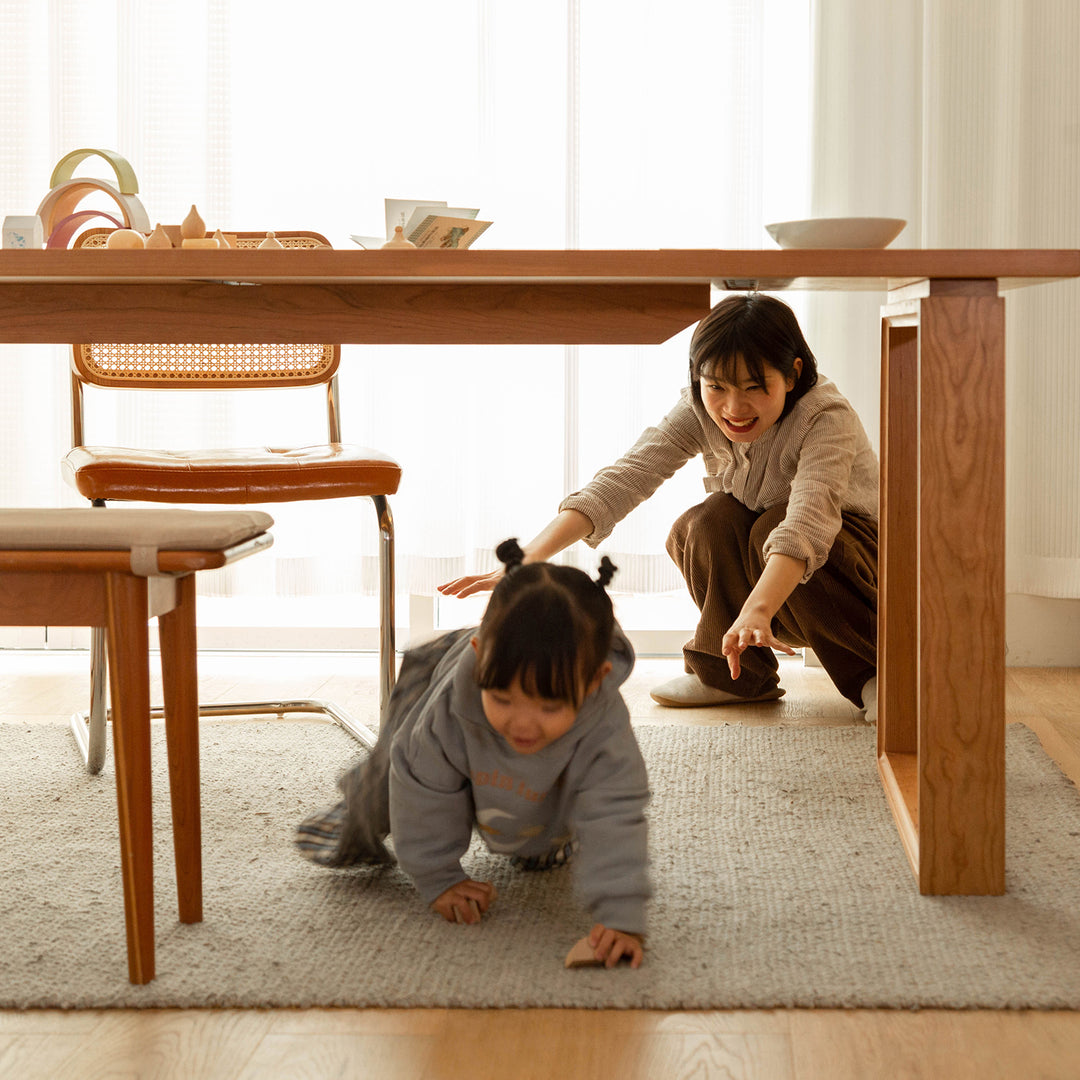 Scandinavian cherry wood dining table blue whale in panoramic view.
