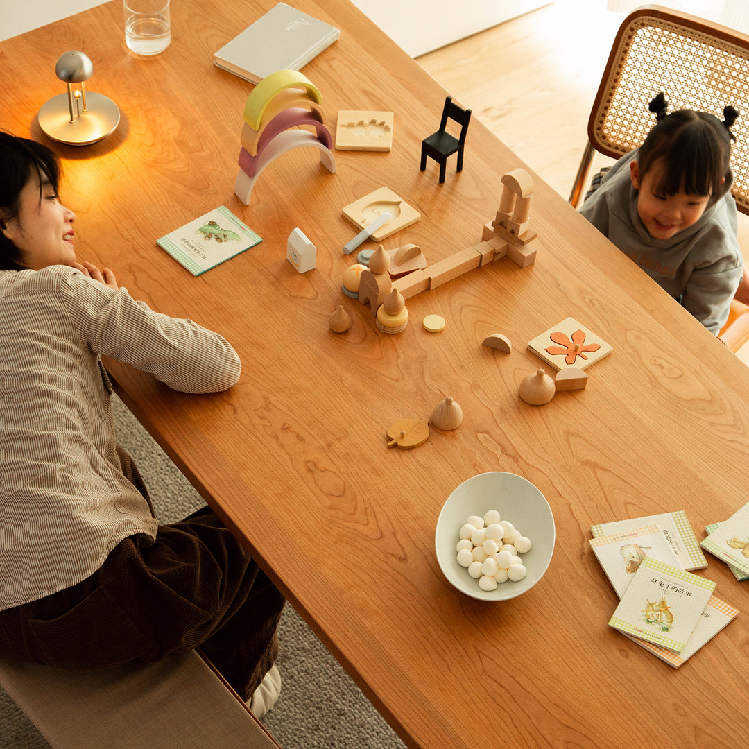 Scandinavian cherry wood dining table blue whale with context.