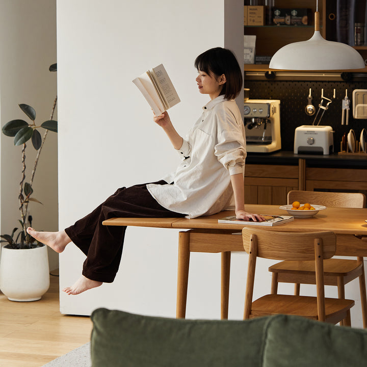Scandinavian cherry wood extendable dining table mcgee in panoramic view.