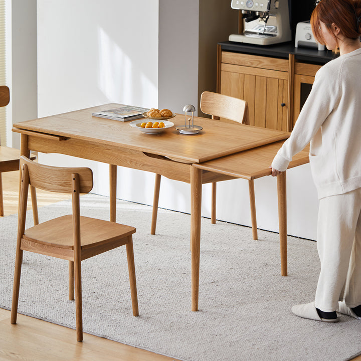 Scandinavian cherry wood extendable dining table mcgee in real life style.