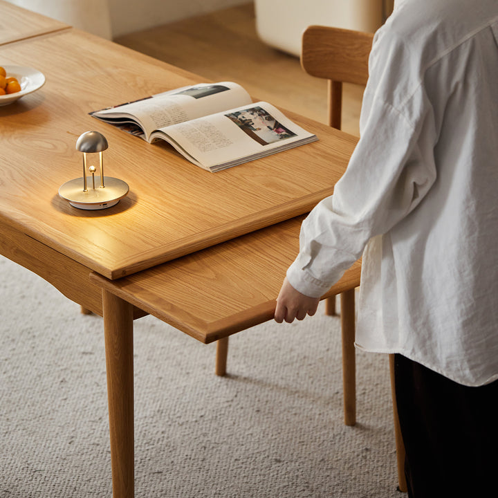 Scandinavian cherry wood extendable dining table mcgee in close up details.
