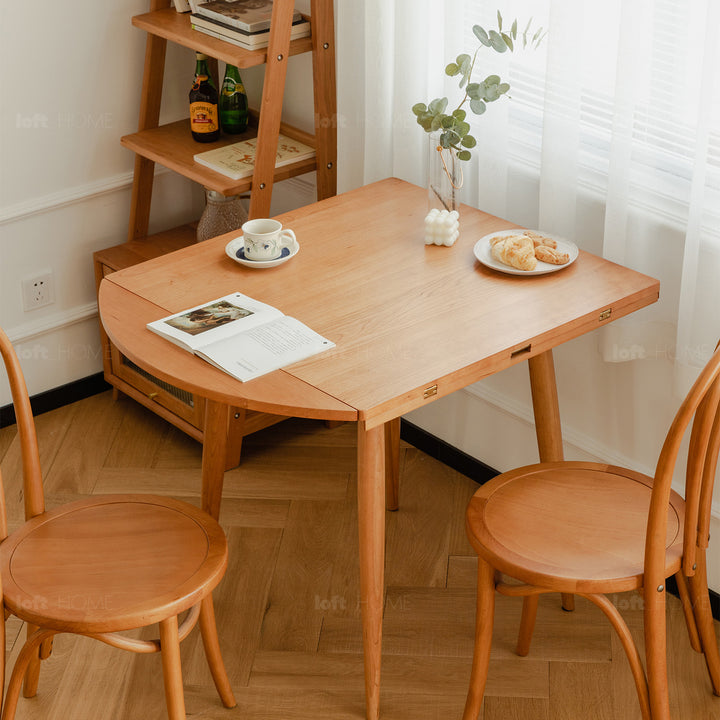 Scandinavian cherry wood extendable round dining table greekn in details.
