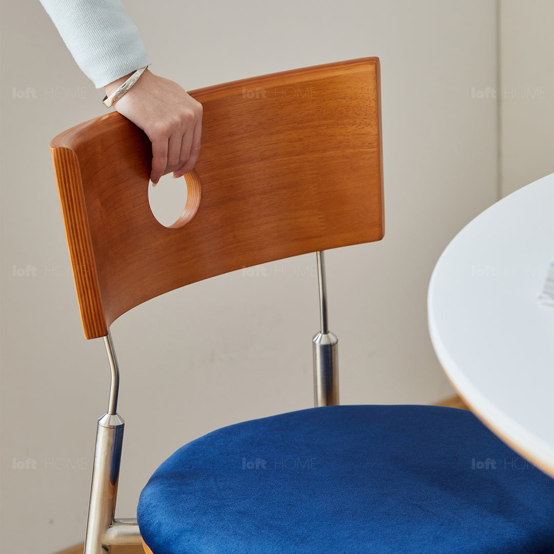 Scandinavian cherry wood mix weave fabric dining chair timeless in panoramic view.