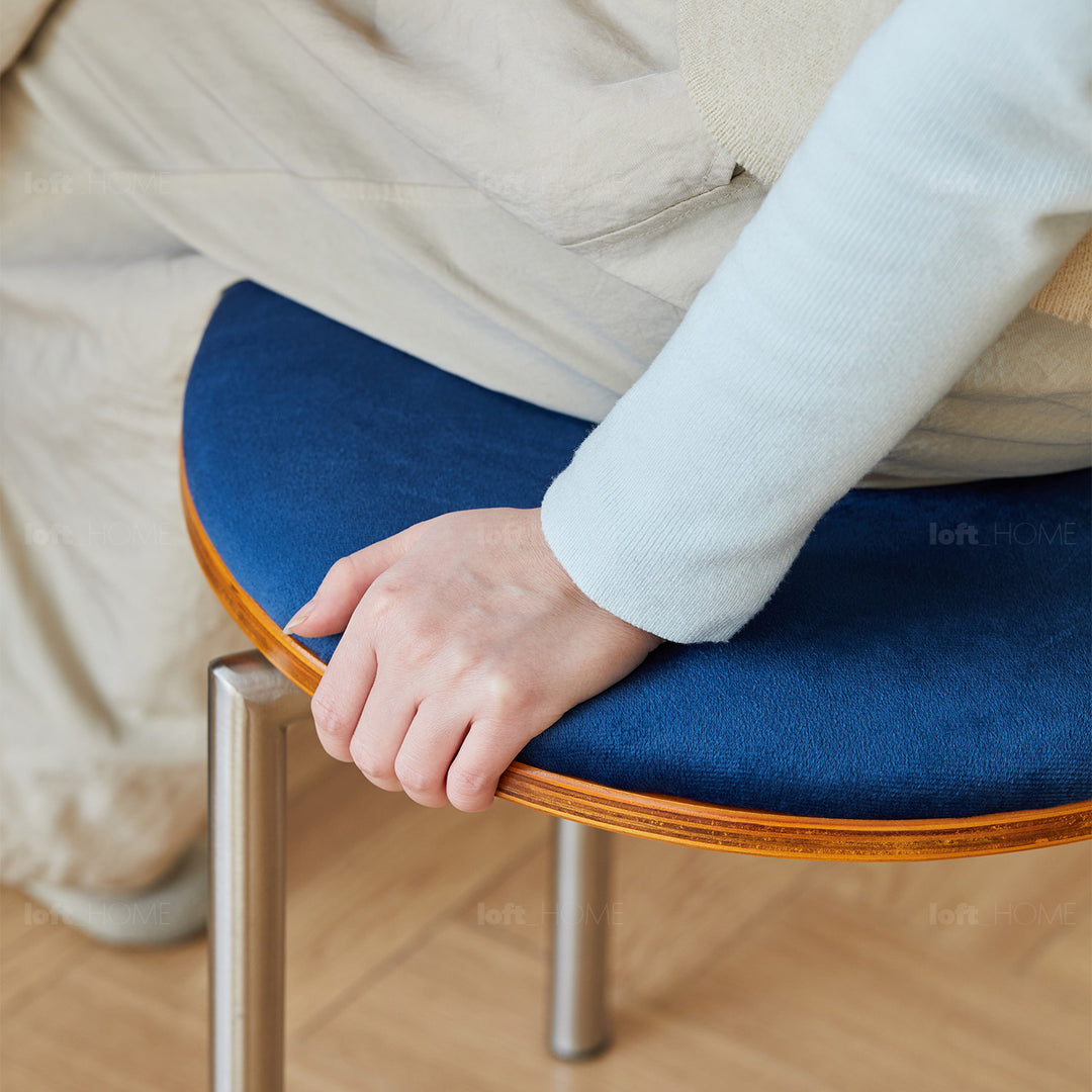Scandinavian cherry wood mix weave fabric dining chair timeless in still life.