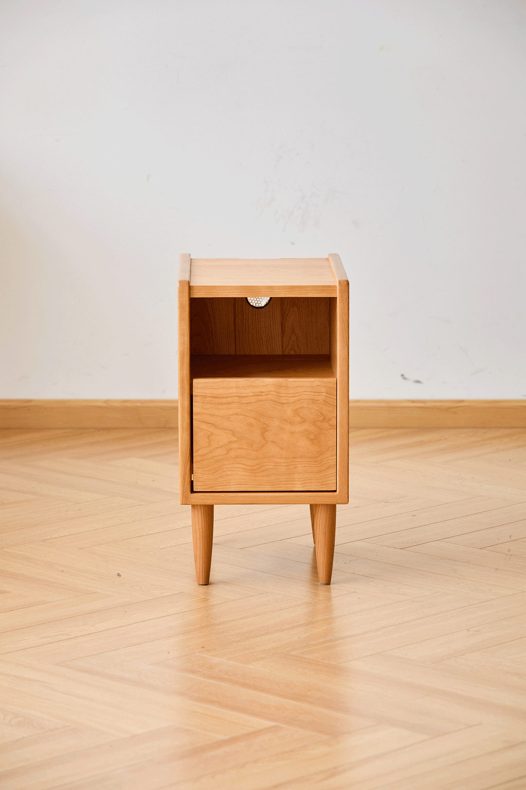 Scandinavian cherry wood side table cubo in close up details.