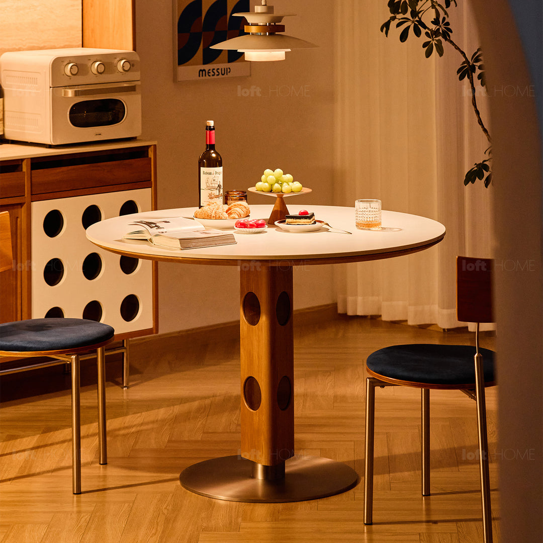 Scandinavian cherry wood sintered stone round dining table timeless in panoramic view.