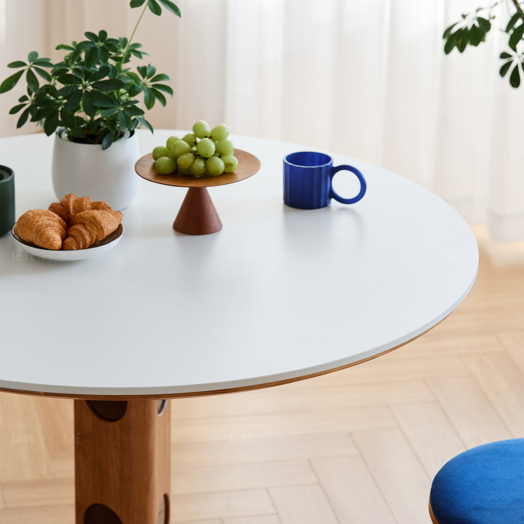 Scandinavian cherry wood sintered stone round dining table timeless layered structure.
