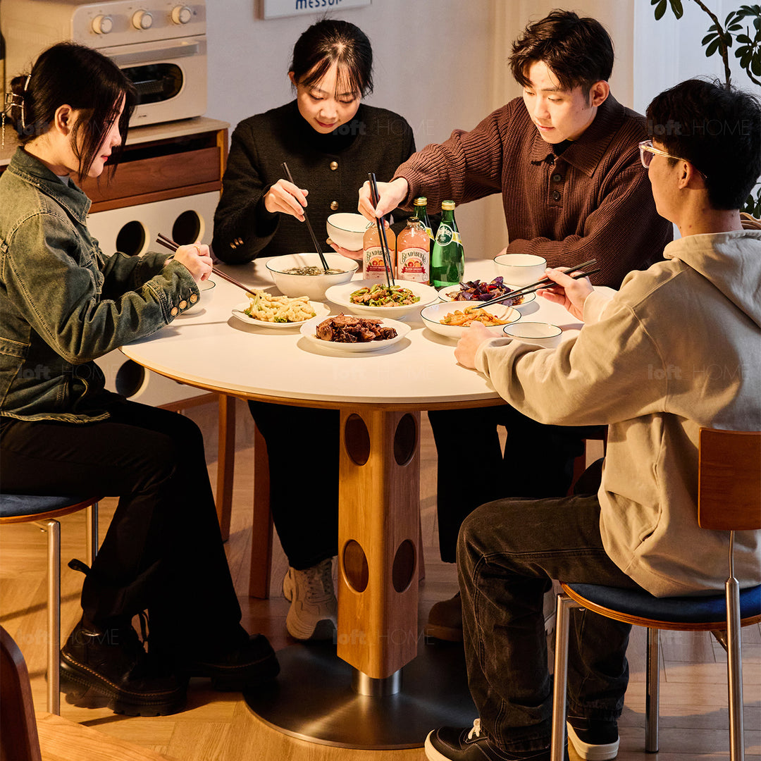 Scandinavian cherry wood sintered stone round dining table timeless in details.