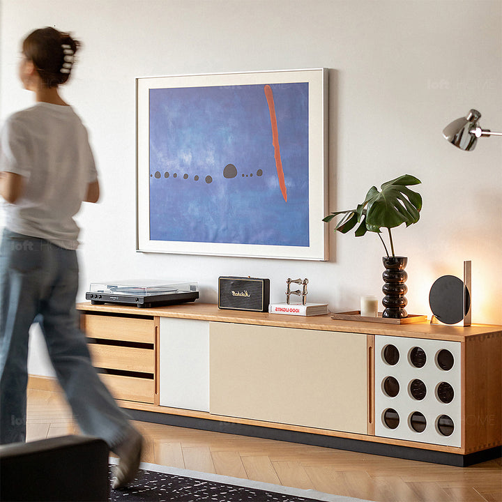 Scandinavian cherry wood sliding door tv console timeless in still life.