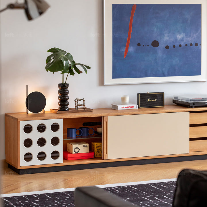 Scandinavian cherry wood sliding door tv console timeless in close up details.