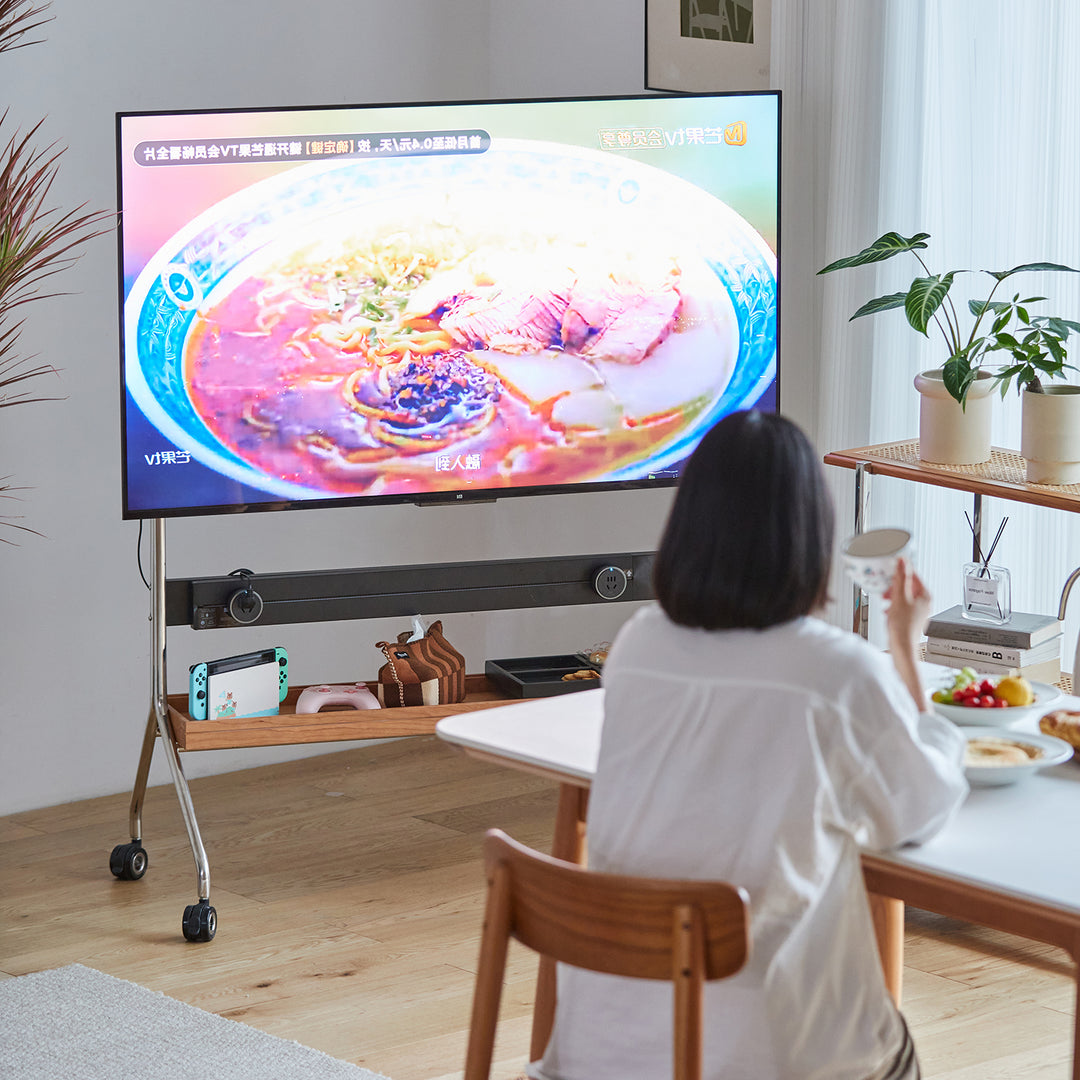 Scandinavian cherry wood tv hanger hal with context.