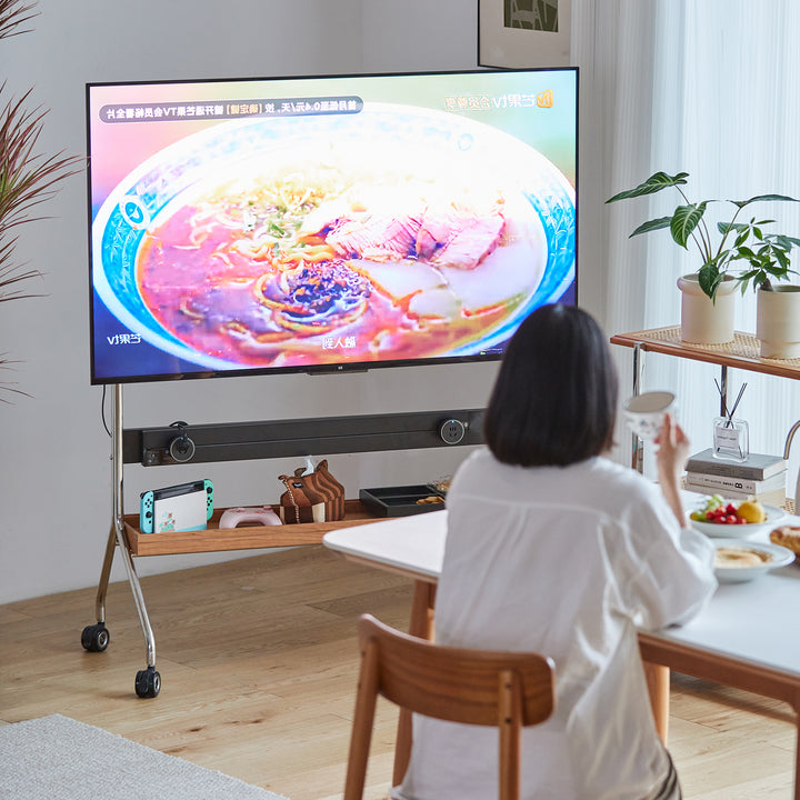 Scandinavian cherry wood tv hanger hal with context.