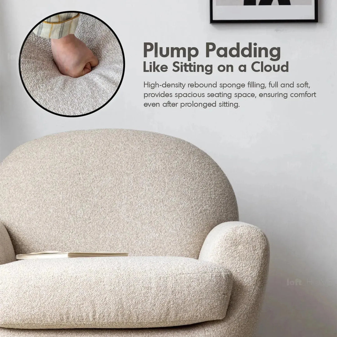 Cream faux cashmere fabric revolving 1 seater sofa rond in panoramic view.