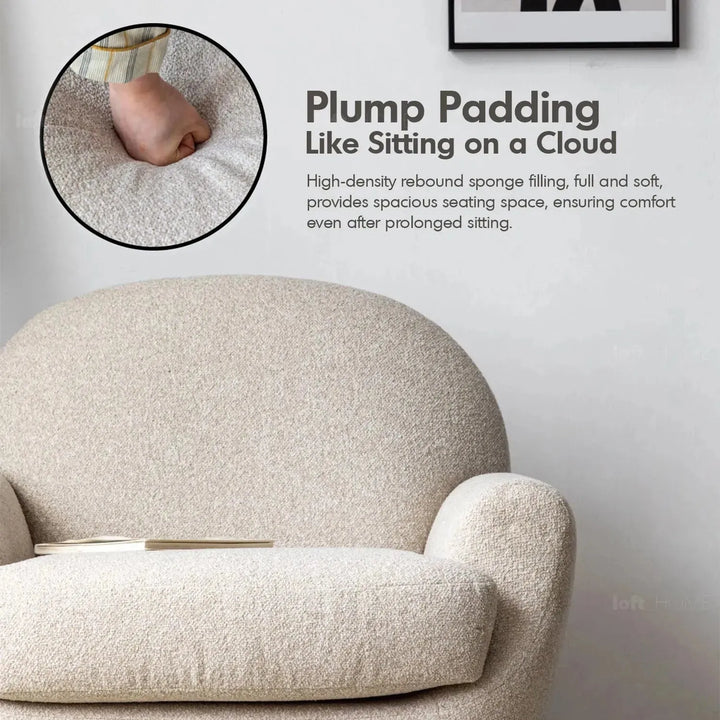 Cream faux cashmere fabric revolving 1 seater sofa rond in panoramic view.