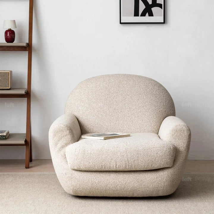 Cream faux cashmere fabric revolving 1 seater sofa rond in still life.