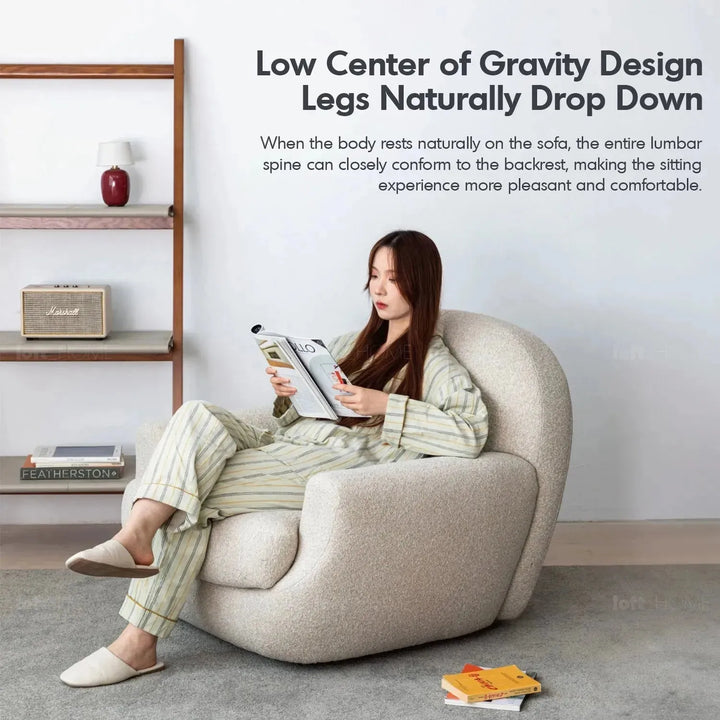 Cream faux cashmere fabric revolving 1 seater sofa rond with context.