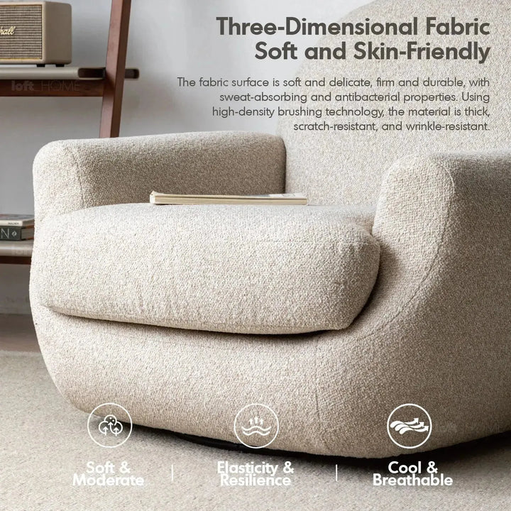 Cream faux cashmere fabric revolving 1 seater sofa rond in close up details.