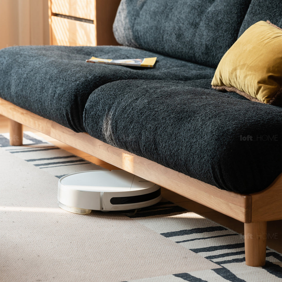 Scandinavian mixed weave fabric cherry wood 3 seater sofa undermoon with context.