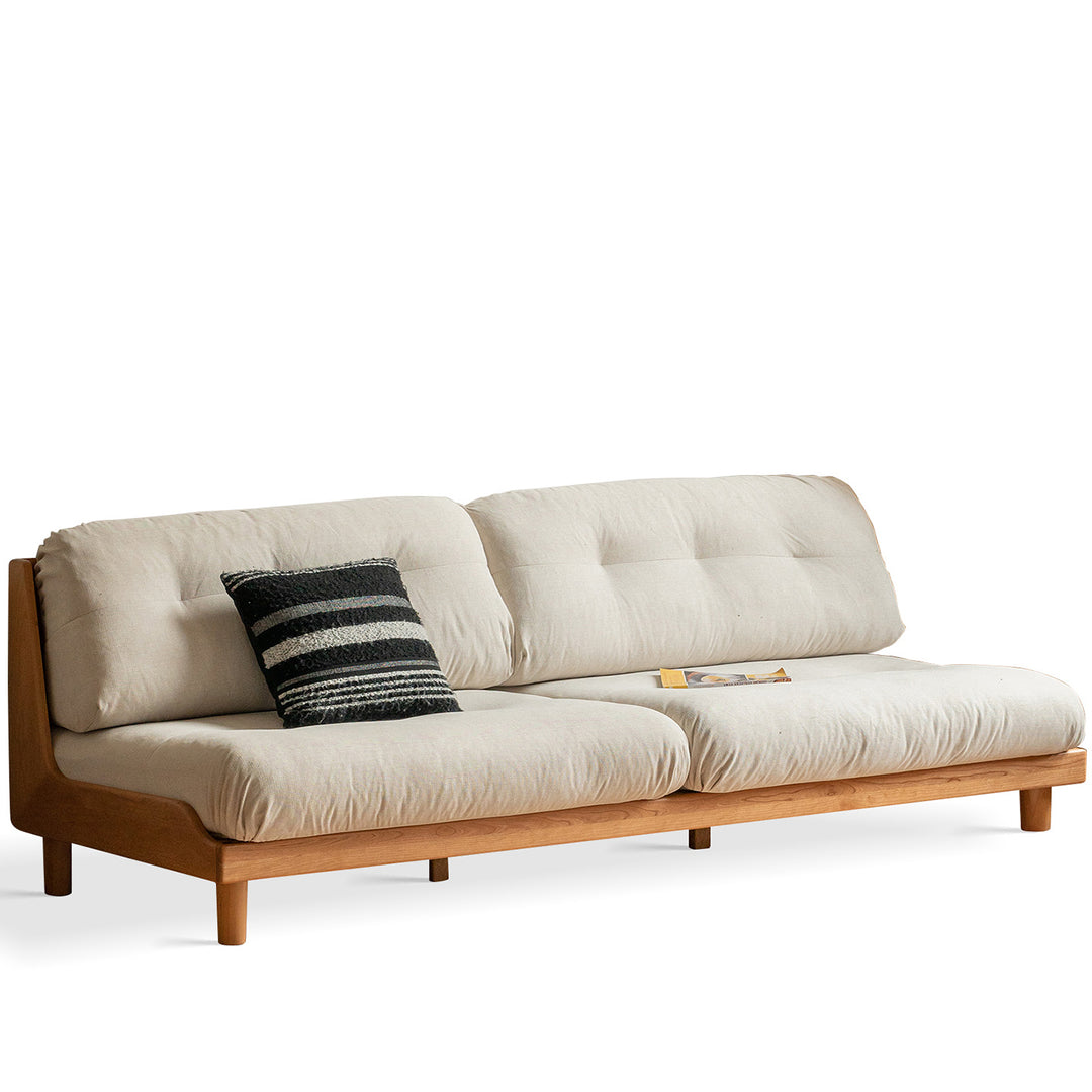 Scandinavian mixed weave fabric cherry wood 3 seater sofa undermoon in still life.