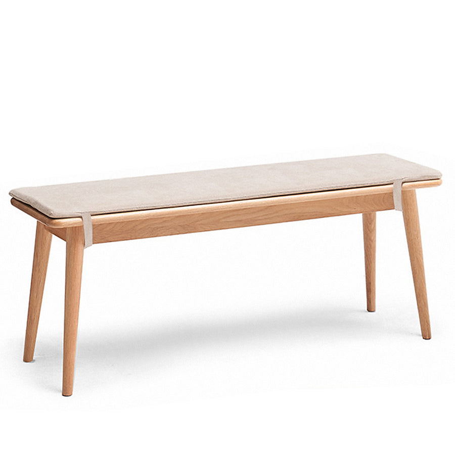 Scandinavian oak wood dining bench with cushion sereno in white background.