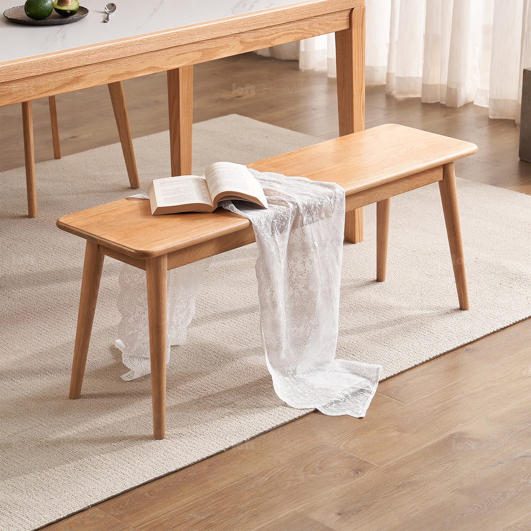 Scandinavian oak wood dining bench with cushion sereno in real life style.