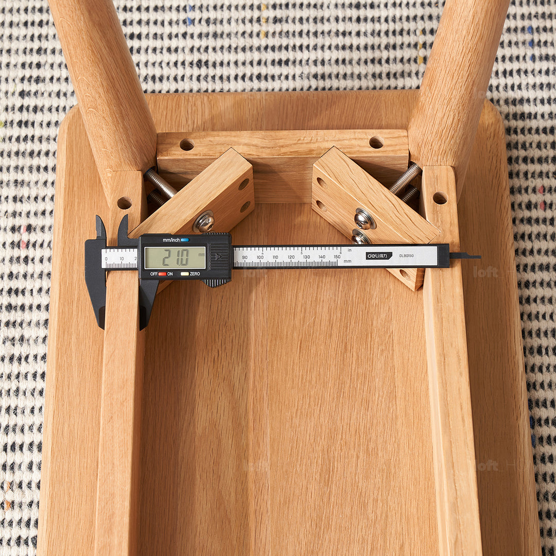 Scandinavian oak wood dining bench with cushion sereno in panoramic view.