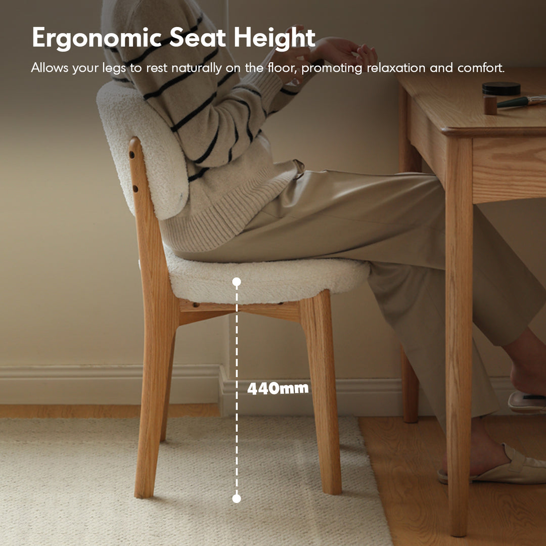 Scandinavian oak wood boucle fabric cover removable dining chair cloud in panoramic view.