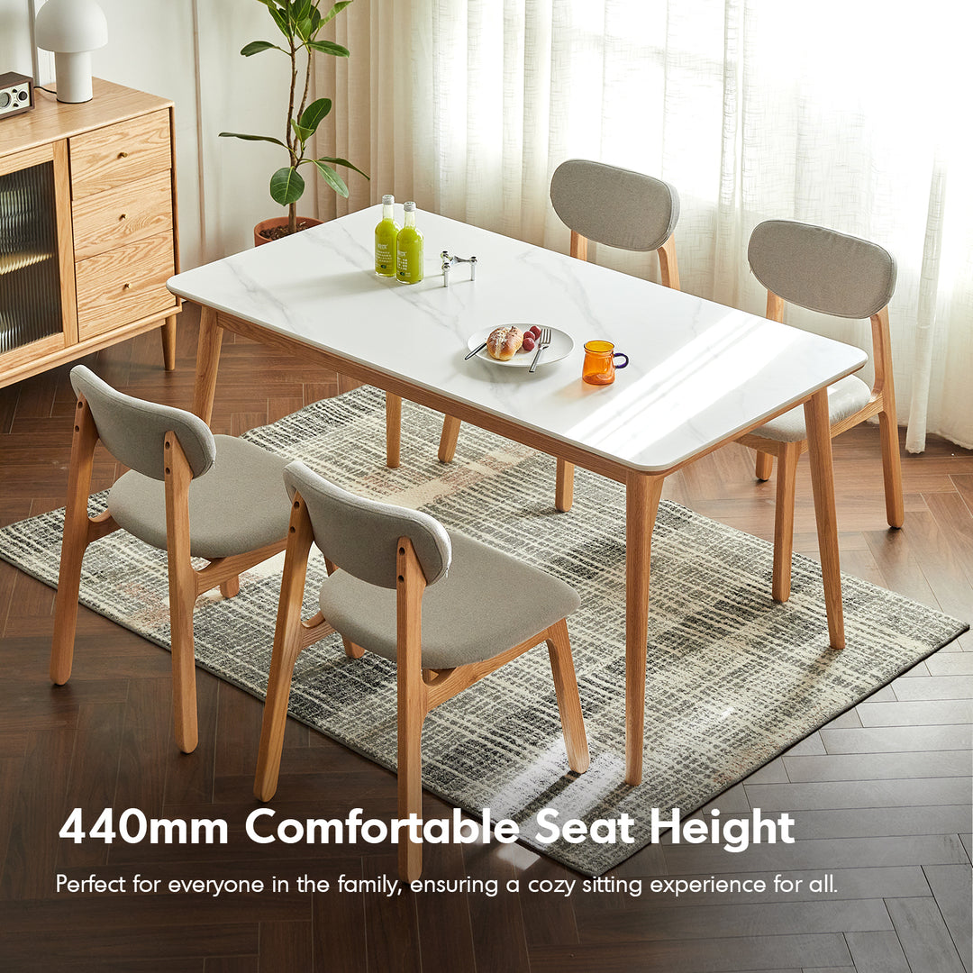 Scandinavian oak wood mixed weave fabric cover removable dining chair nest in still life.