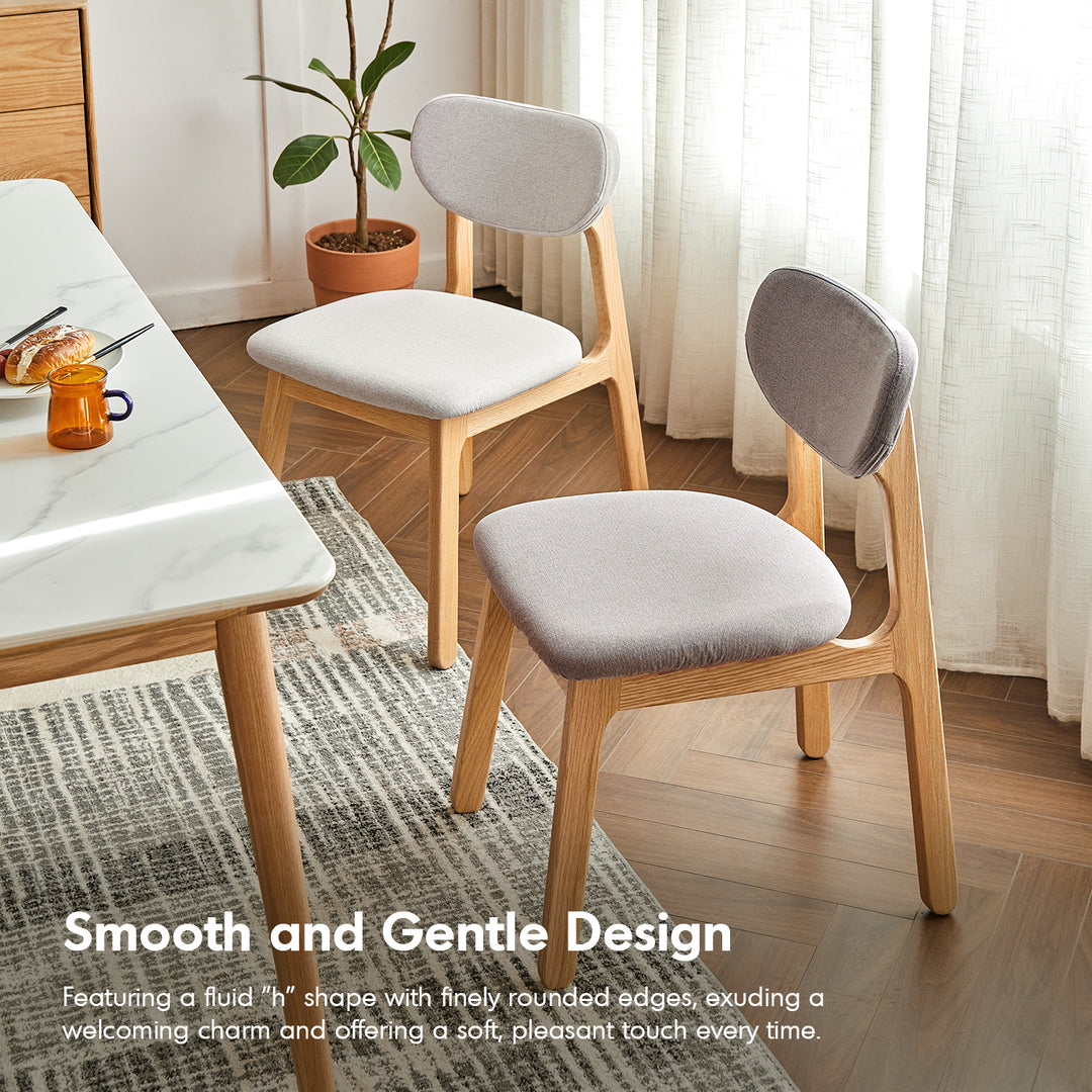 Scandinavian oak wood mixed weave fabric cover removable dining chair nest in details.