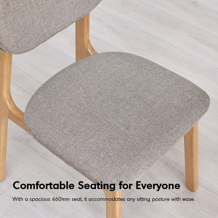 Scandinavian oak wood mixed weave fabric cover removable dining chair nest in close up details.