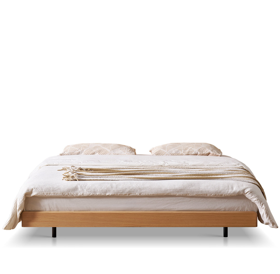 Scandinavian oak wood platform floating bed nora in white background.