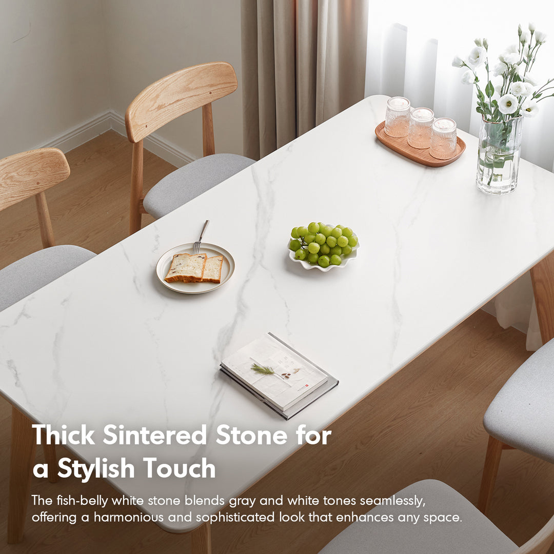 Scandinavian oak wood sintered stone dining table aura with context.